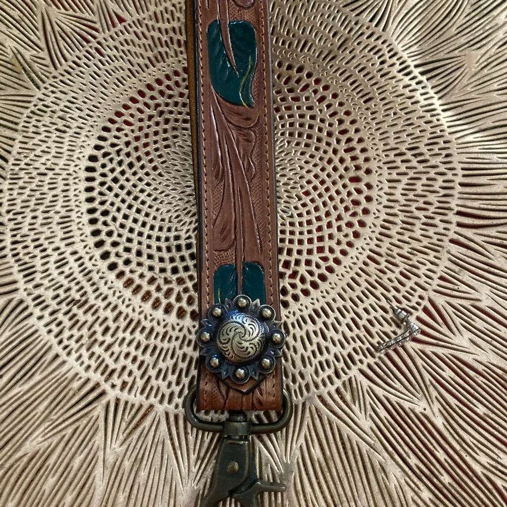 Brown and Green Leather Strap with Decorative Medallion